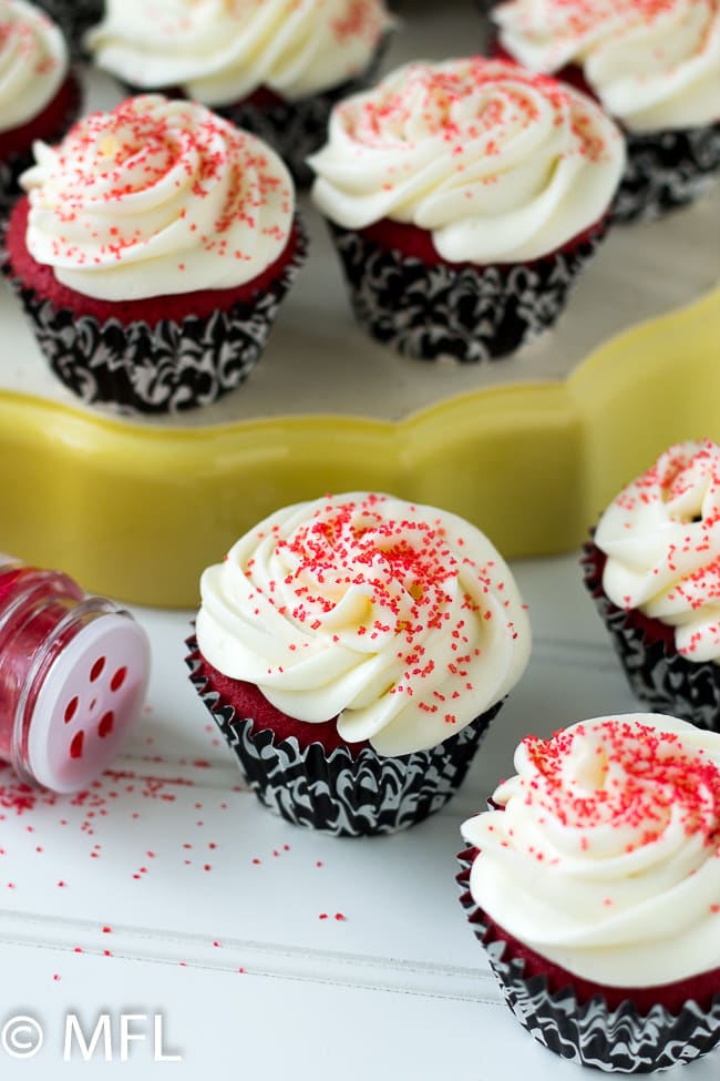 cupcakes on white board with sprinkles in corner