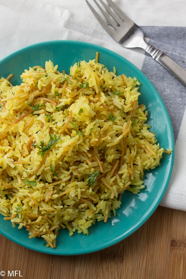 copycat rice a roni on plate with fork next to it