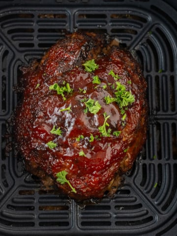 cooked meatloaf in air fryer basket