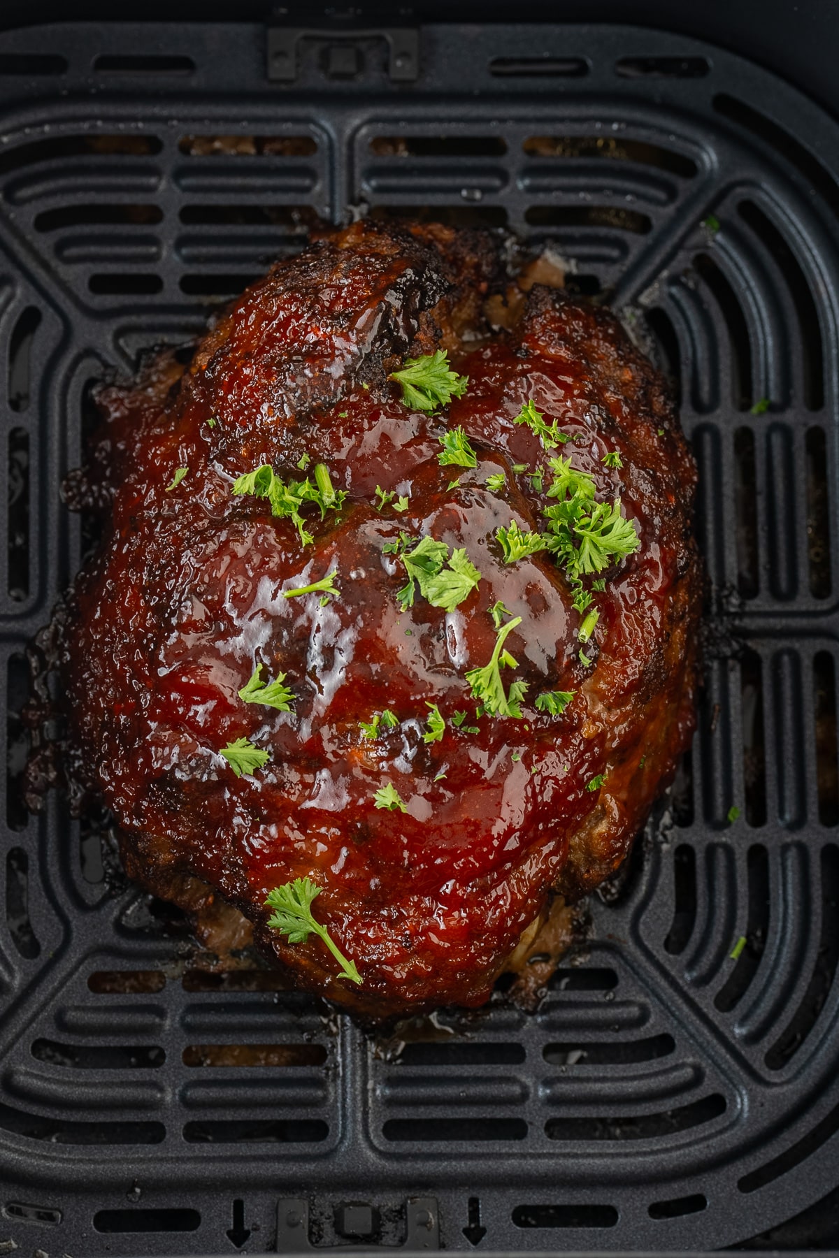 cooked meatloaf in air fryer basket