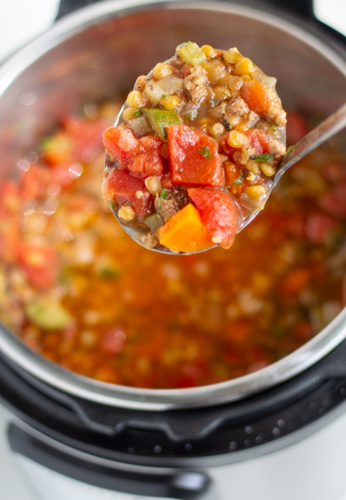 pressure cooker lentil soup on a spoon