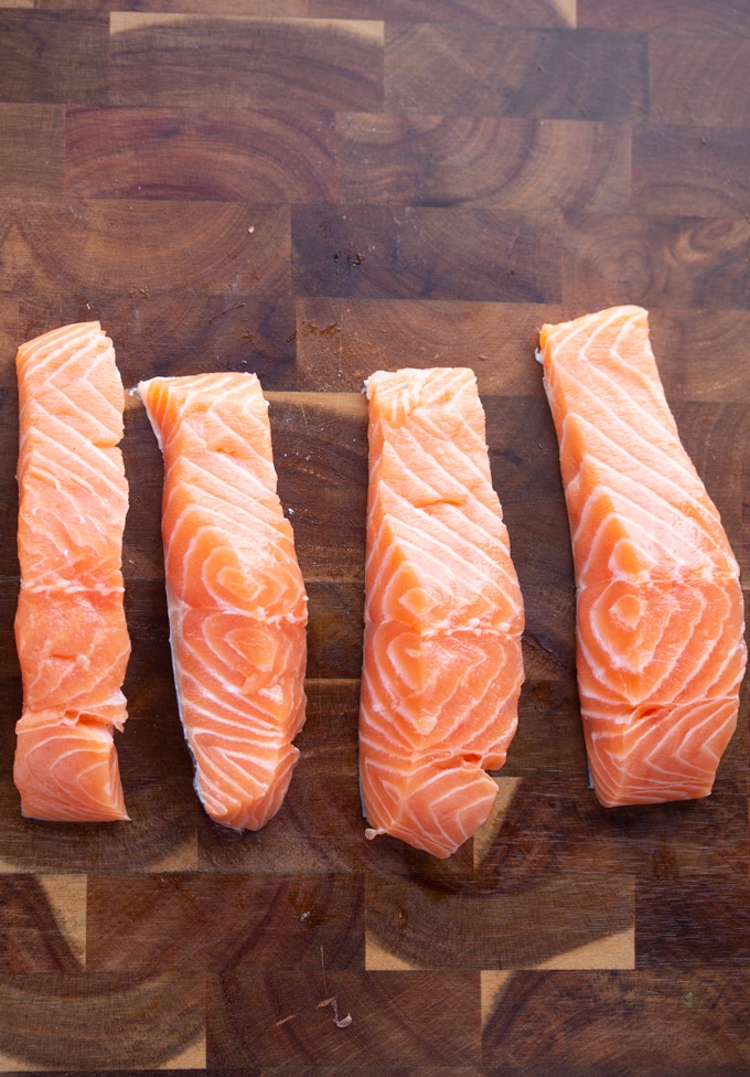 raw salmon on a cutting board