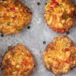 cooked air fryer crab cakes in an air fryer basket