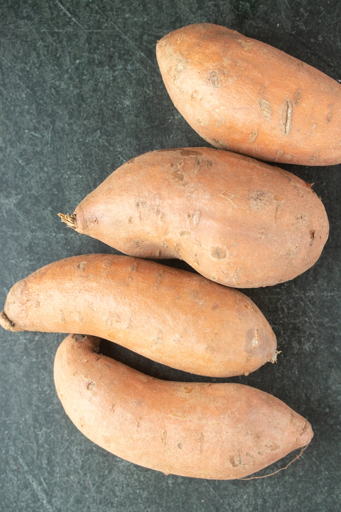four whole ray sweet potatoes 
