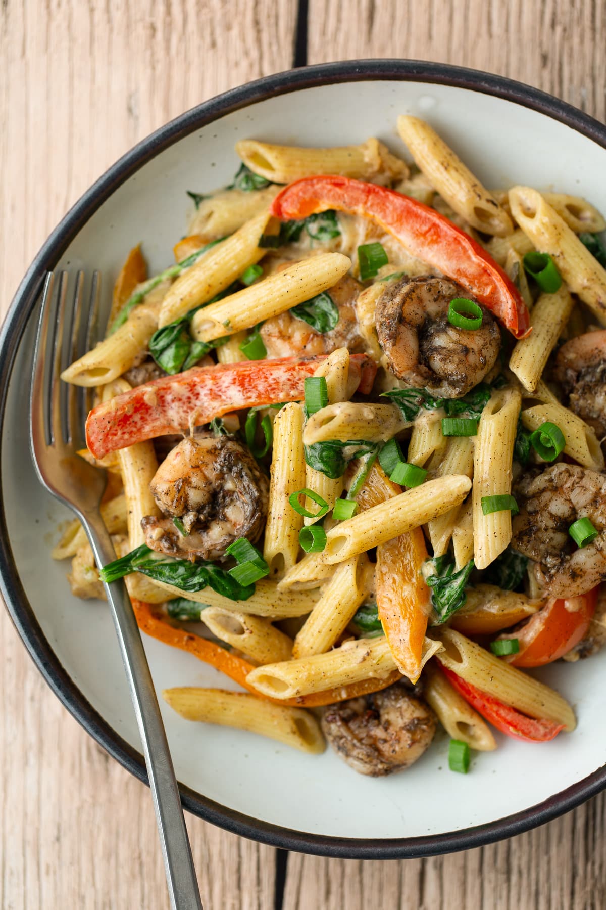 rasta pasta on plate with fork on the side