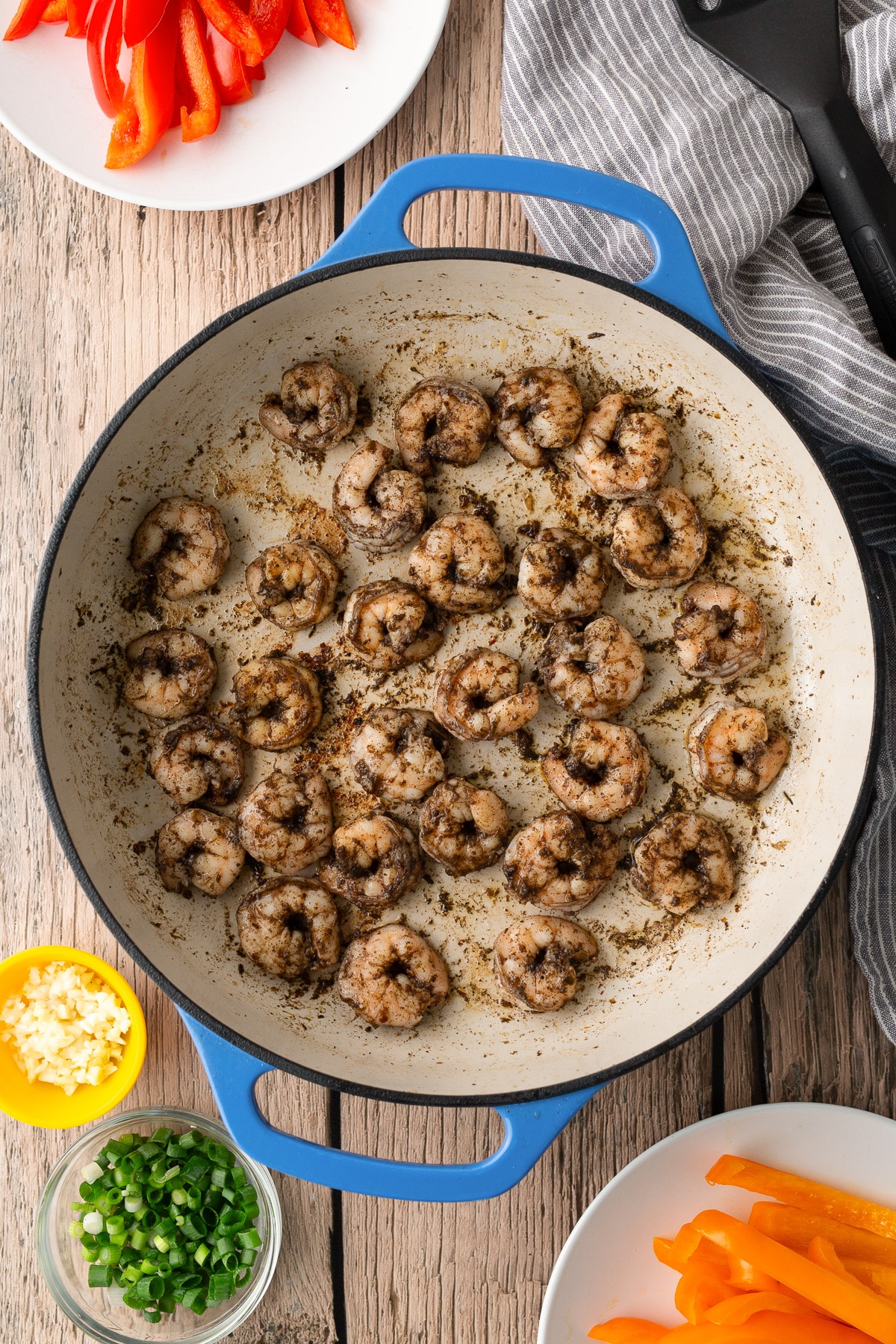 jerk shrimp being seared in skillet