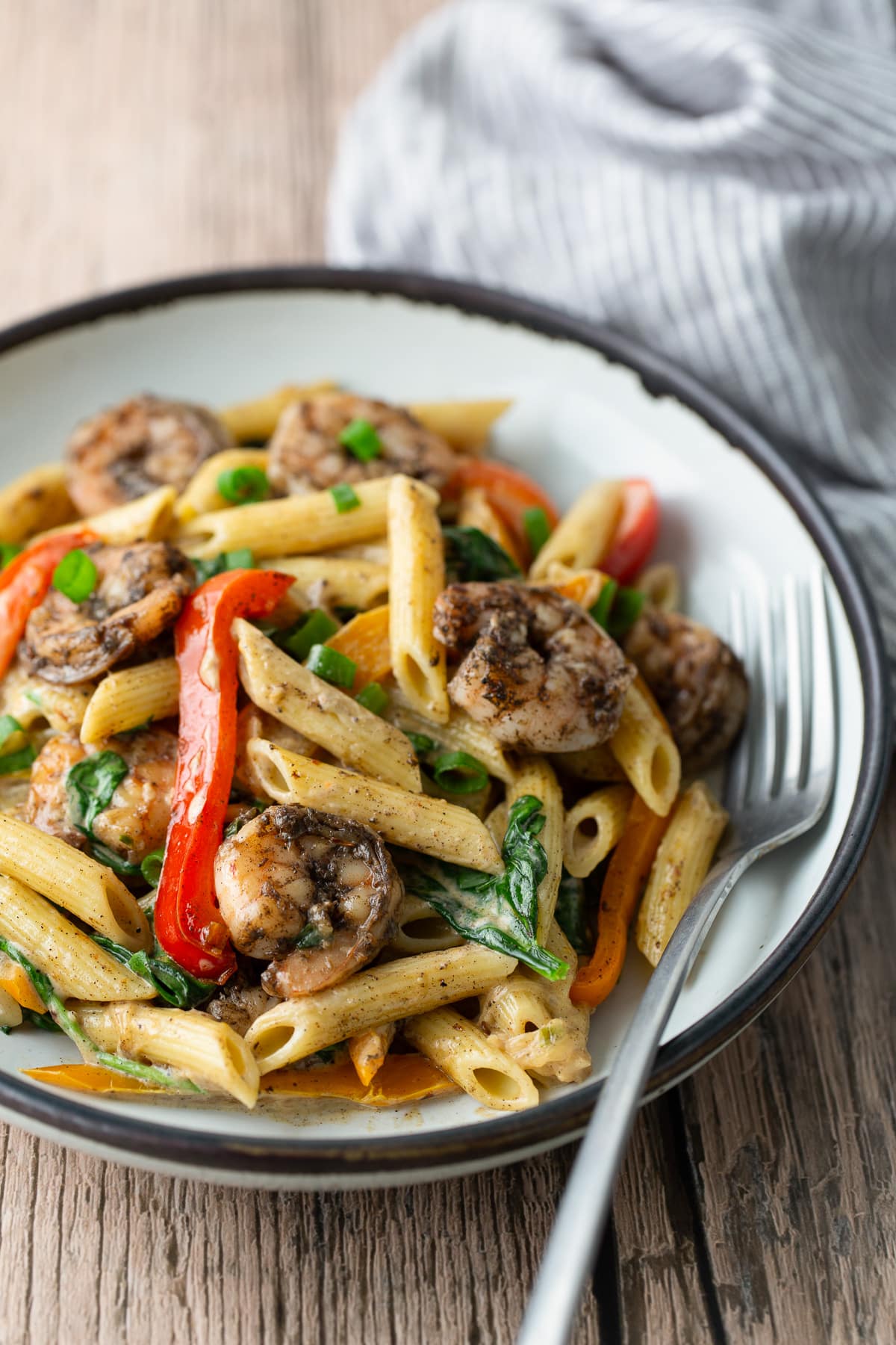 rasta pasta on plate with fork on side