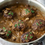 salisbury steak with gravy with parsley on top