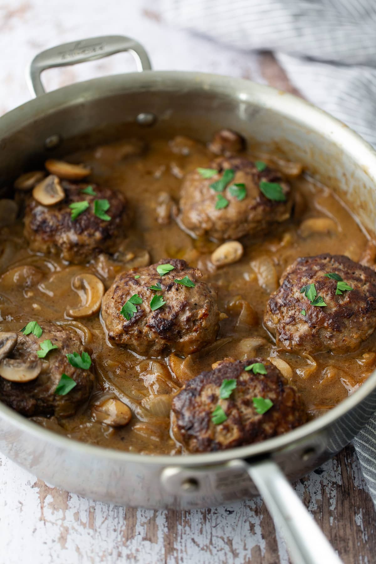 salisbury steak with gravy with parsley on top