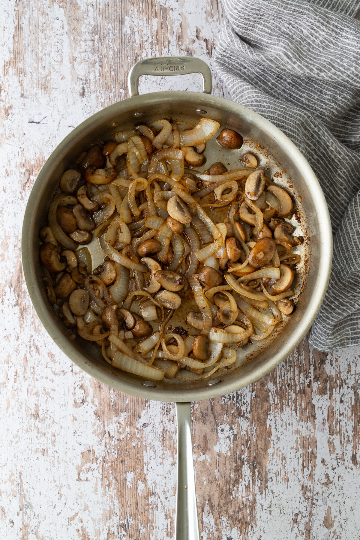 mushrooms and onions sauteed in skillet