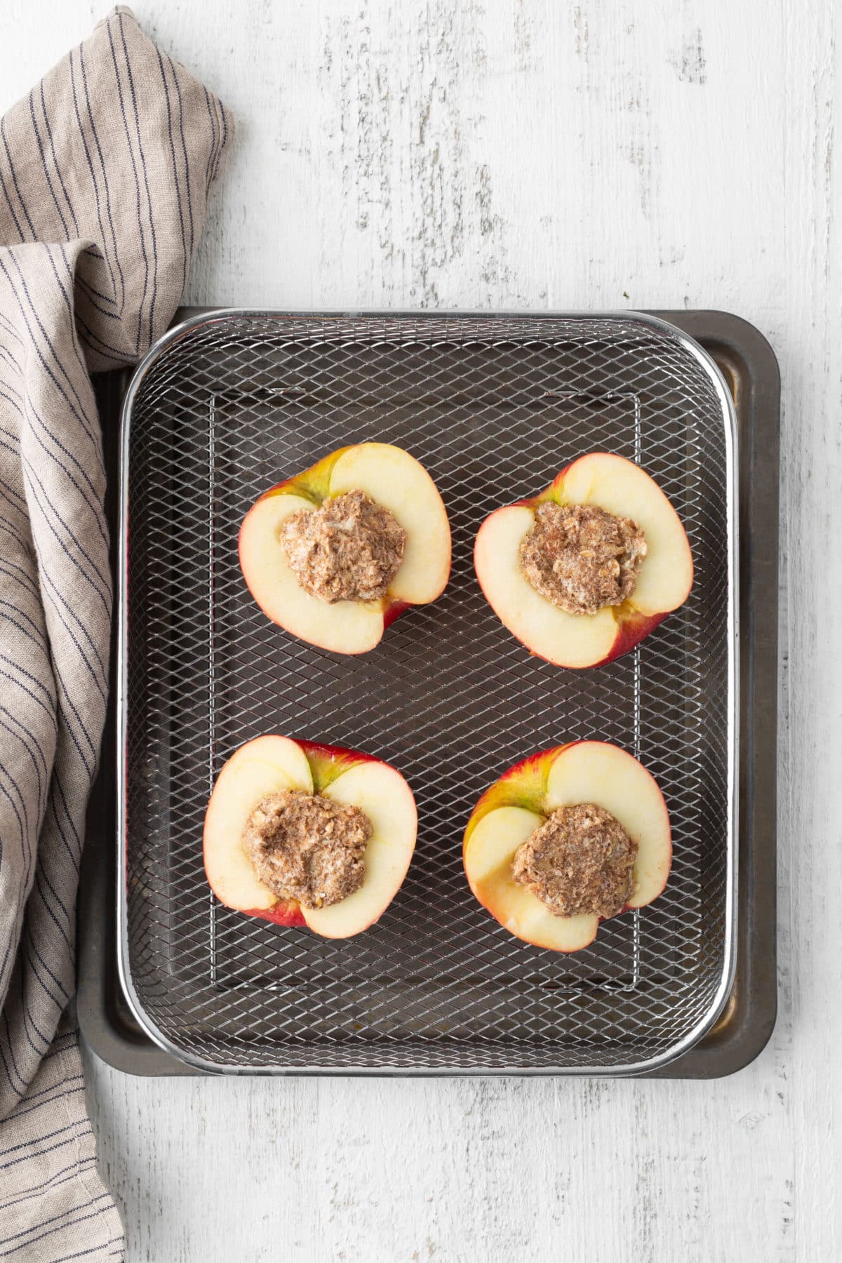 filled apples on air fryer basket