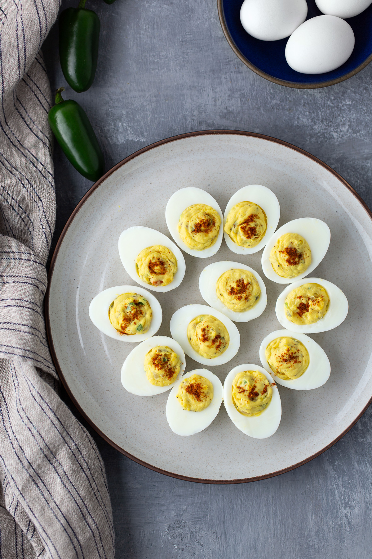 deviled eggs on white plate with napkin on side