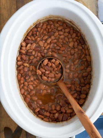 Slow cooker pinto beans cooked in the crock pot.