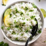 cilantro lime rice in bowl with spoon sticking out