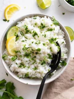 cilantro lime rice in bowl with spoon sticking out