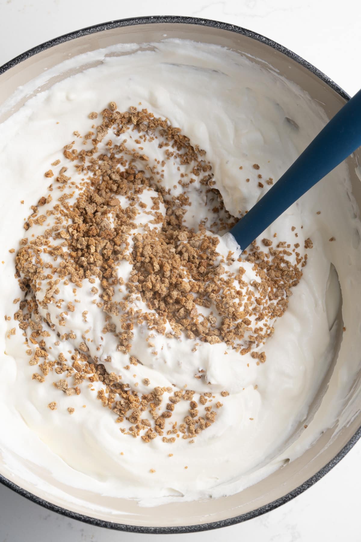 greape nut cereal being added to ice cream base
