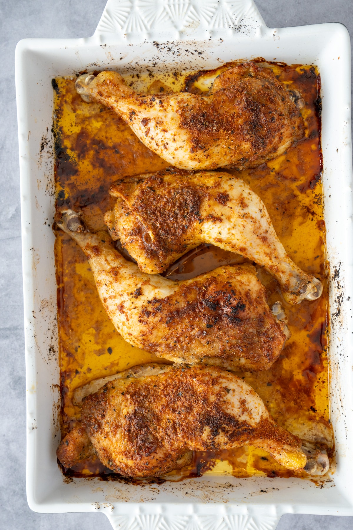 baked chicken leg quarters in baking pan