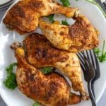 baked chicken leg quarters on plate