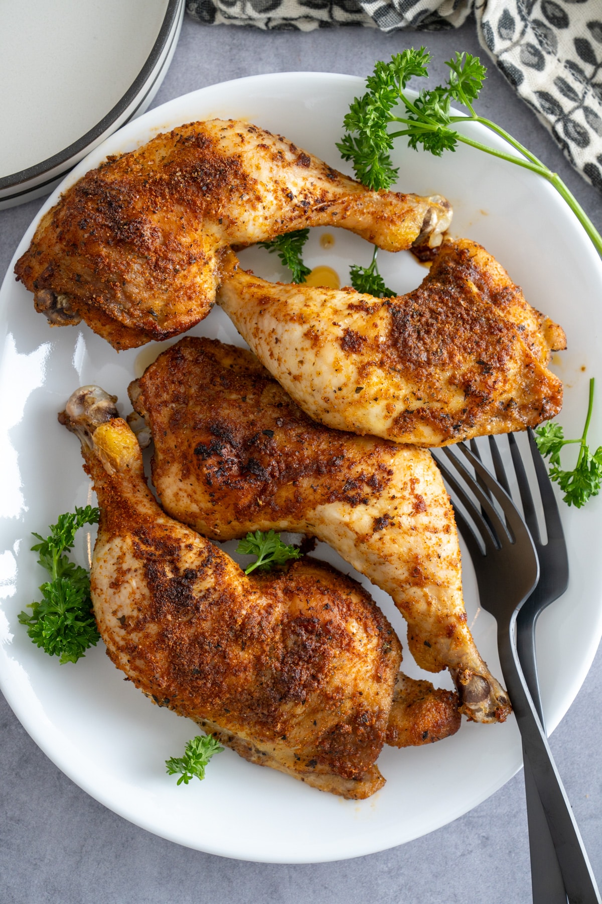 baked chicken leg quarters on plate