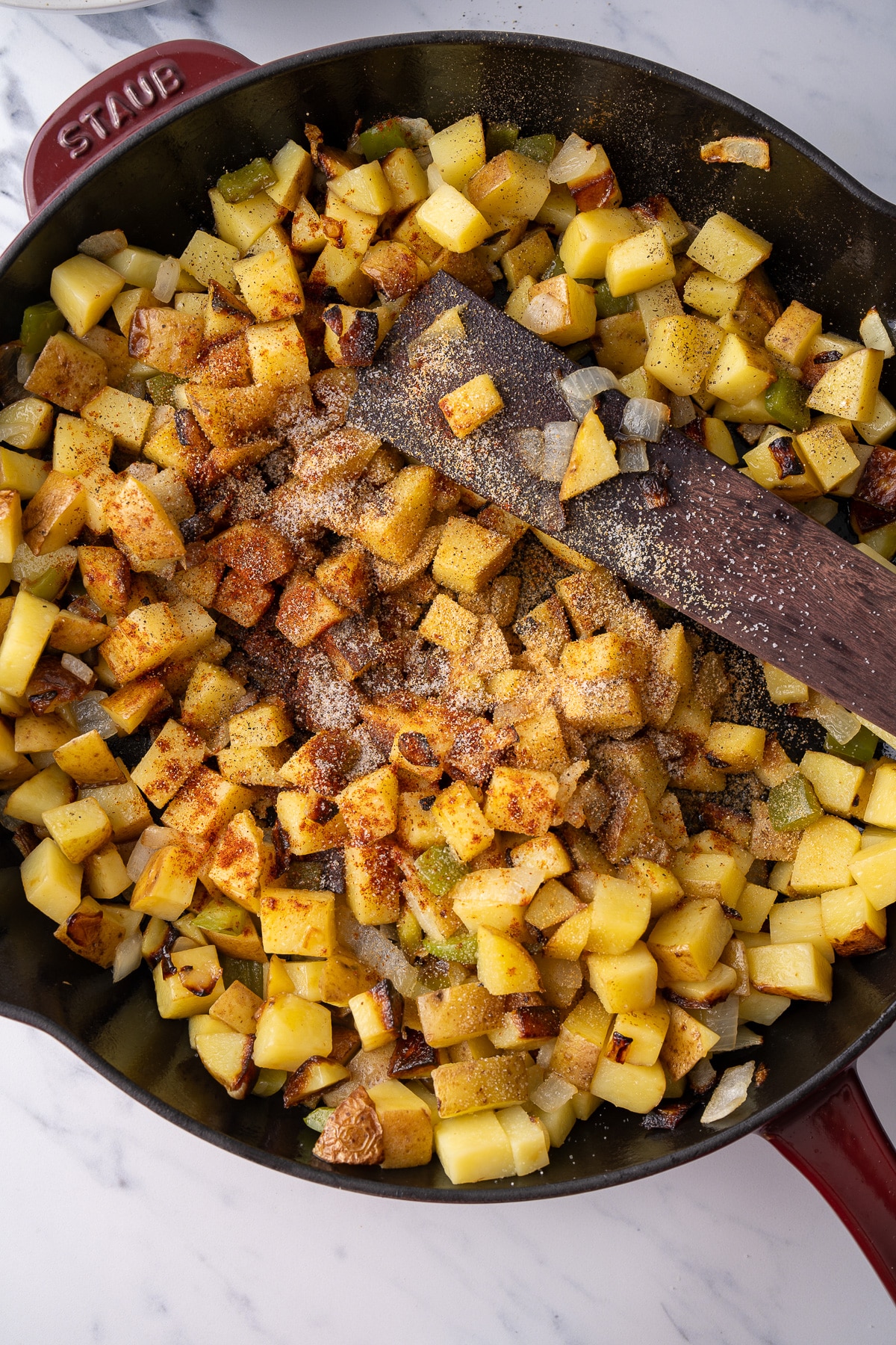 seasoning added to potatoes