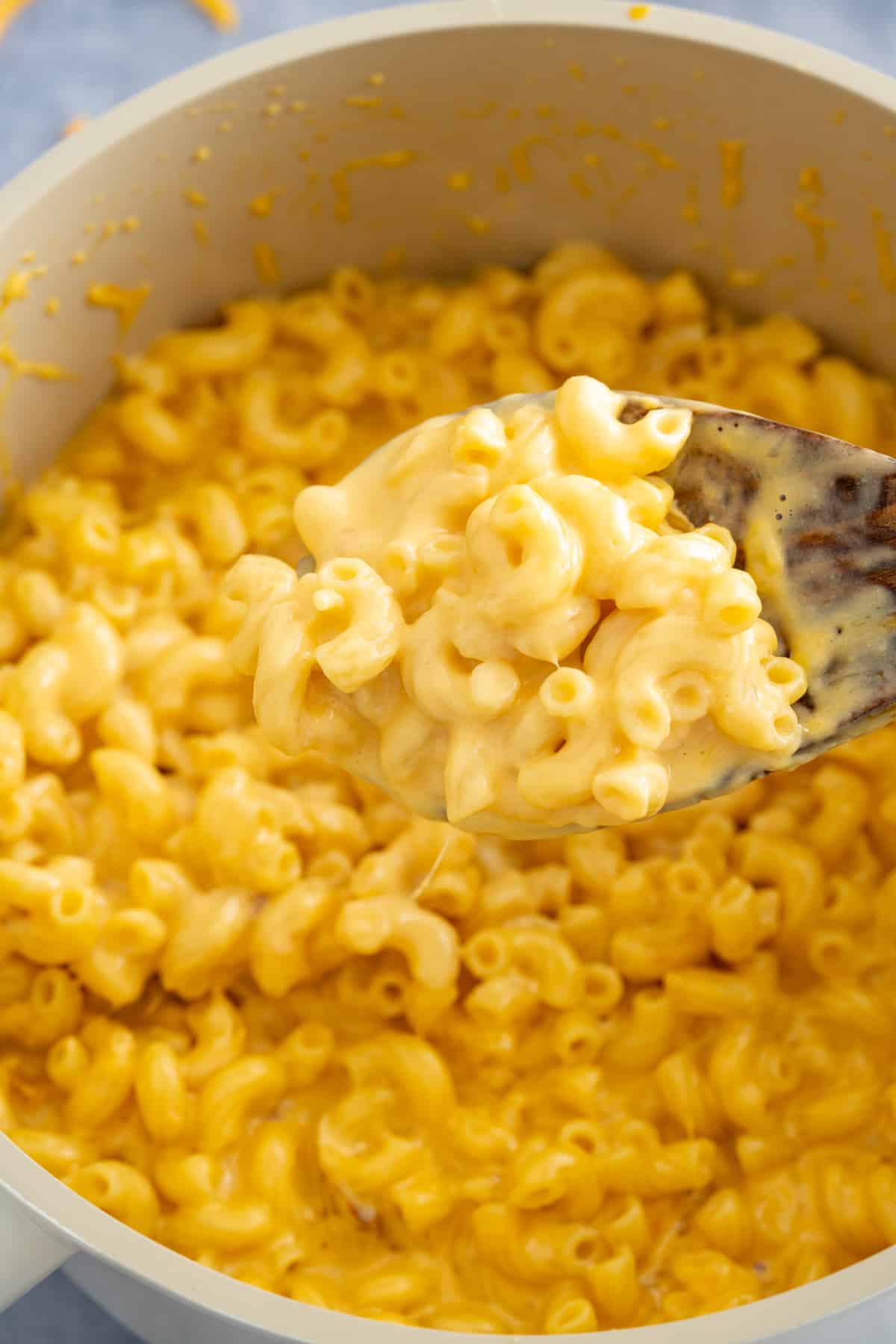 spoon lifting mac and cheese