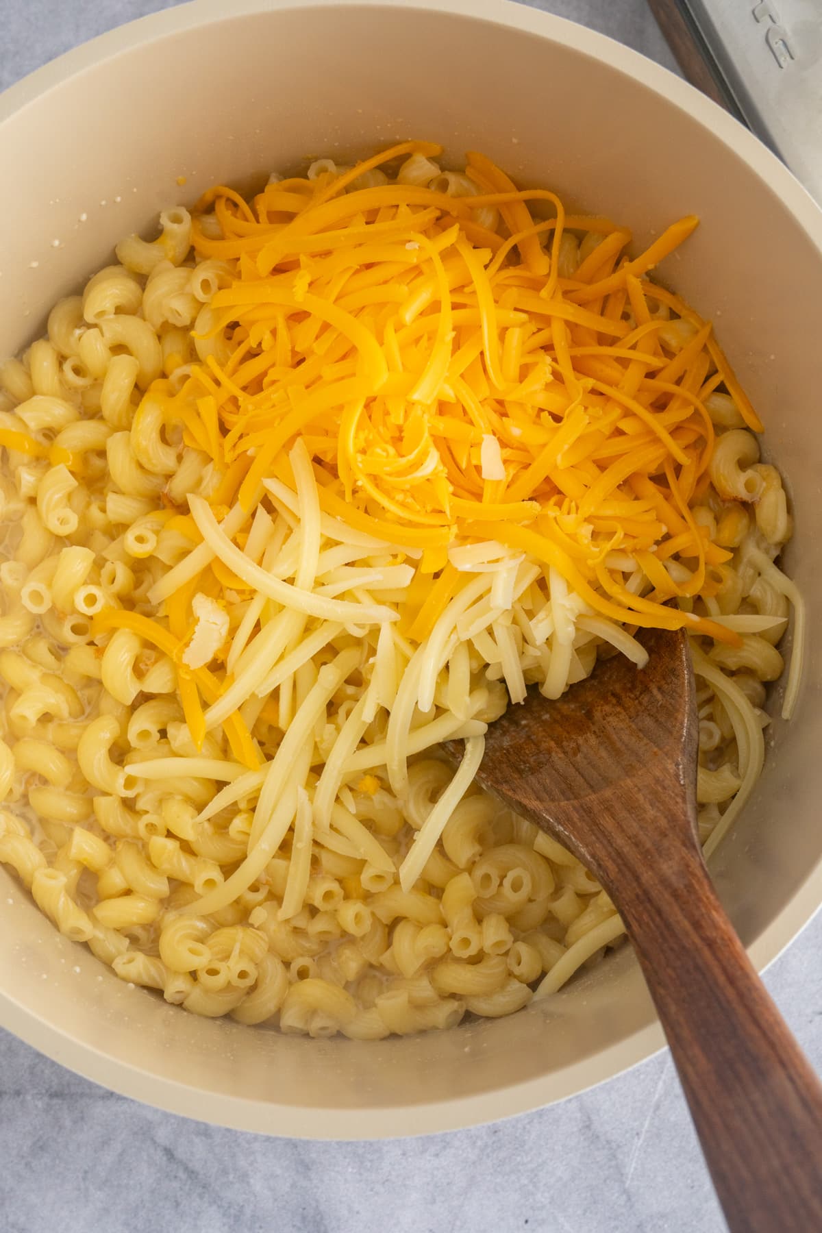 cheese on top of macaroni with spoon sticking out