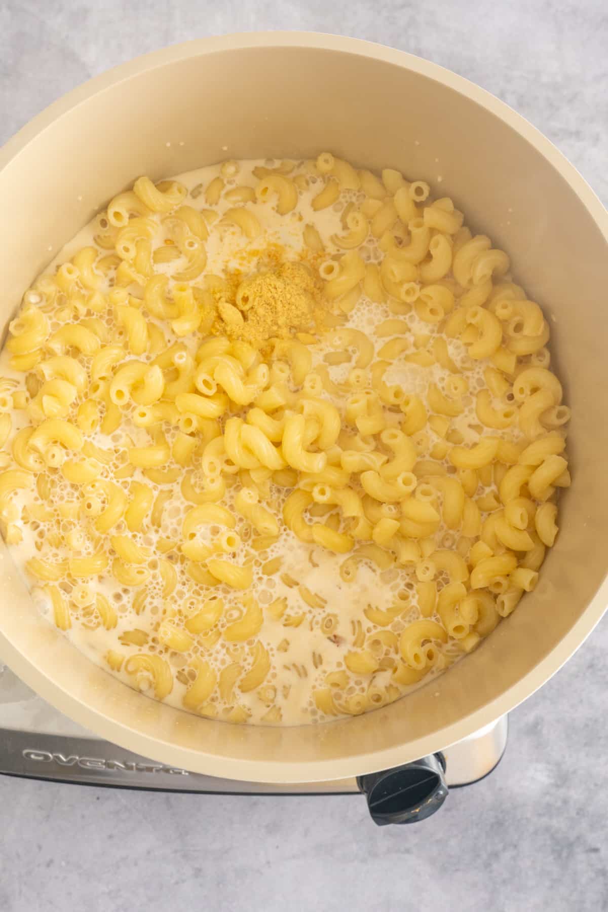 evaporated milk and noodles in pot