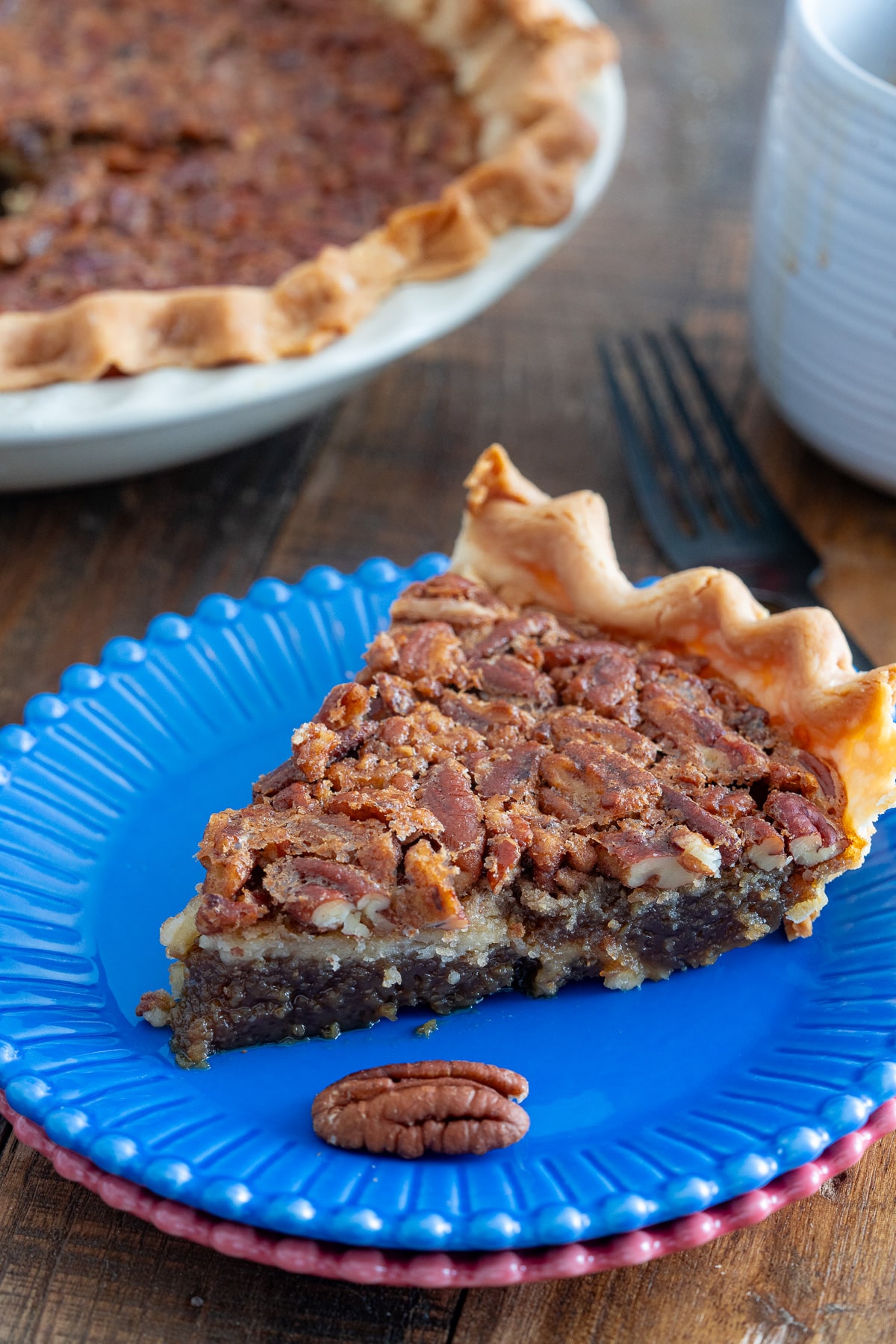 slice of pecan pie on blue plate