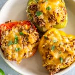 3 stuffed bell peppers on a plate