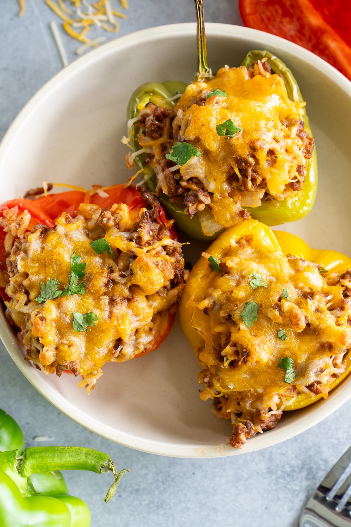 3 stuffed bell peppers on a plate