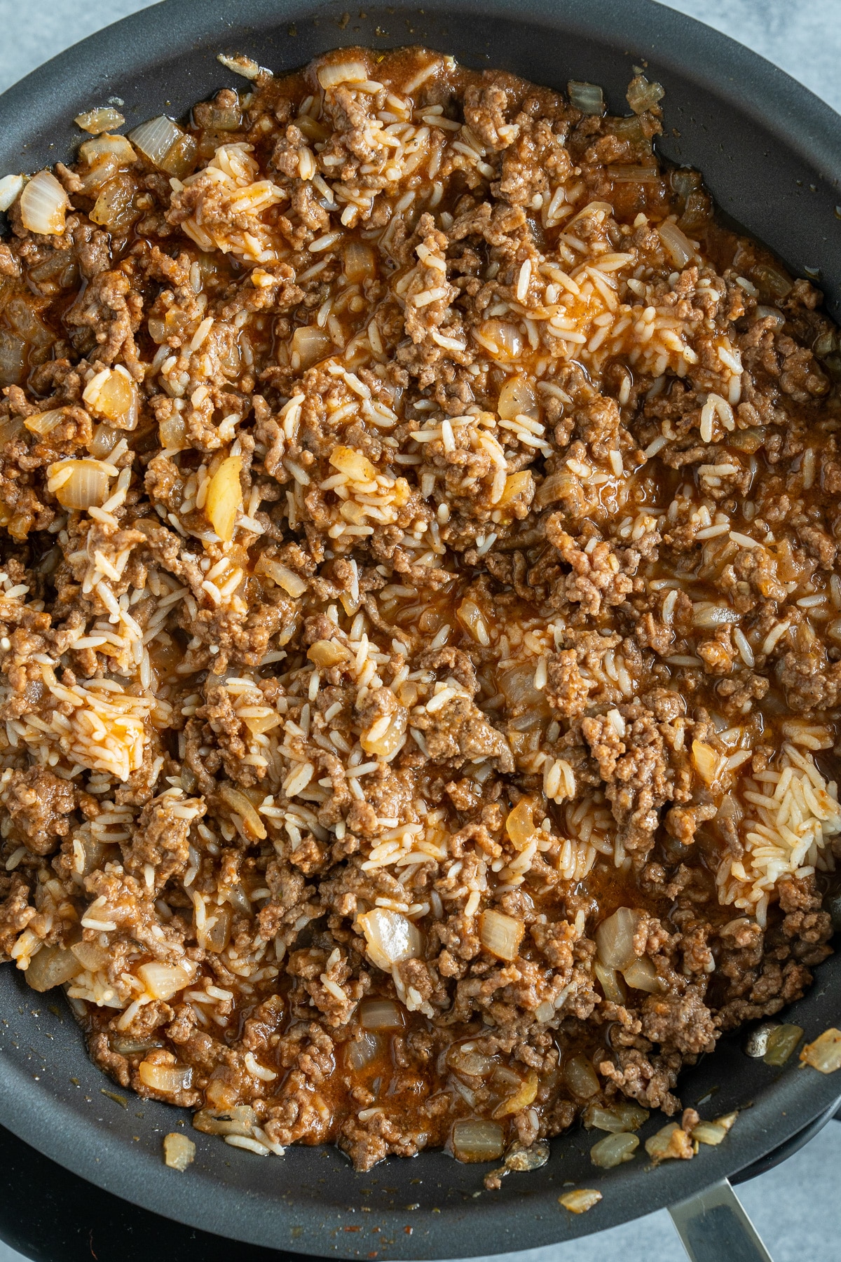 meat mixture in skillet with rice added