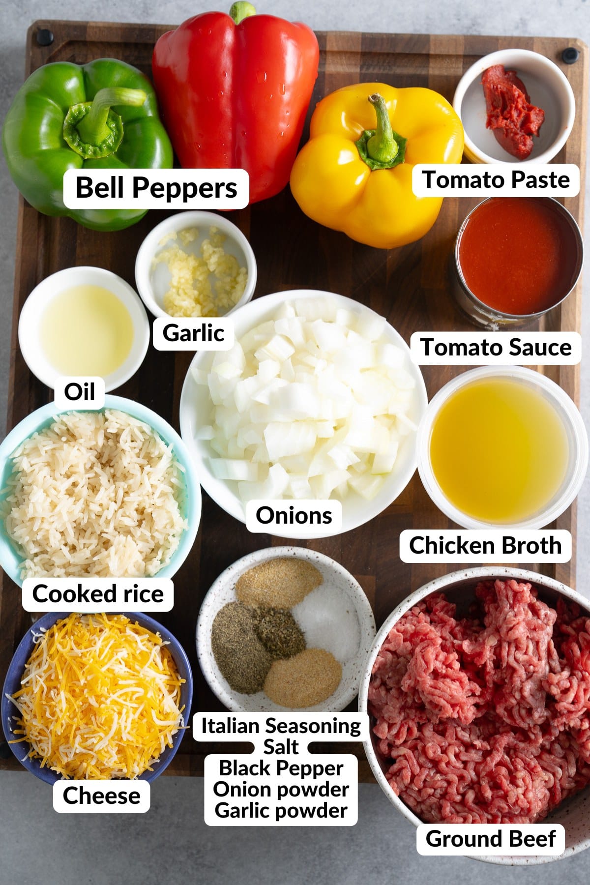 ingredients for stuffed bell peppers on wooden cutting board