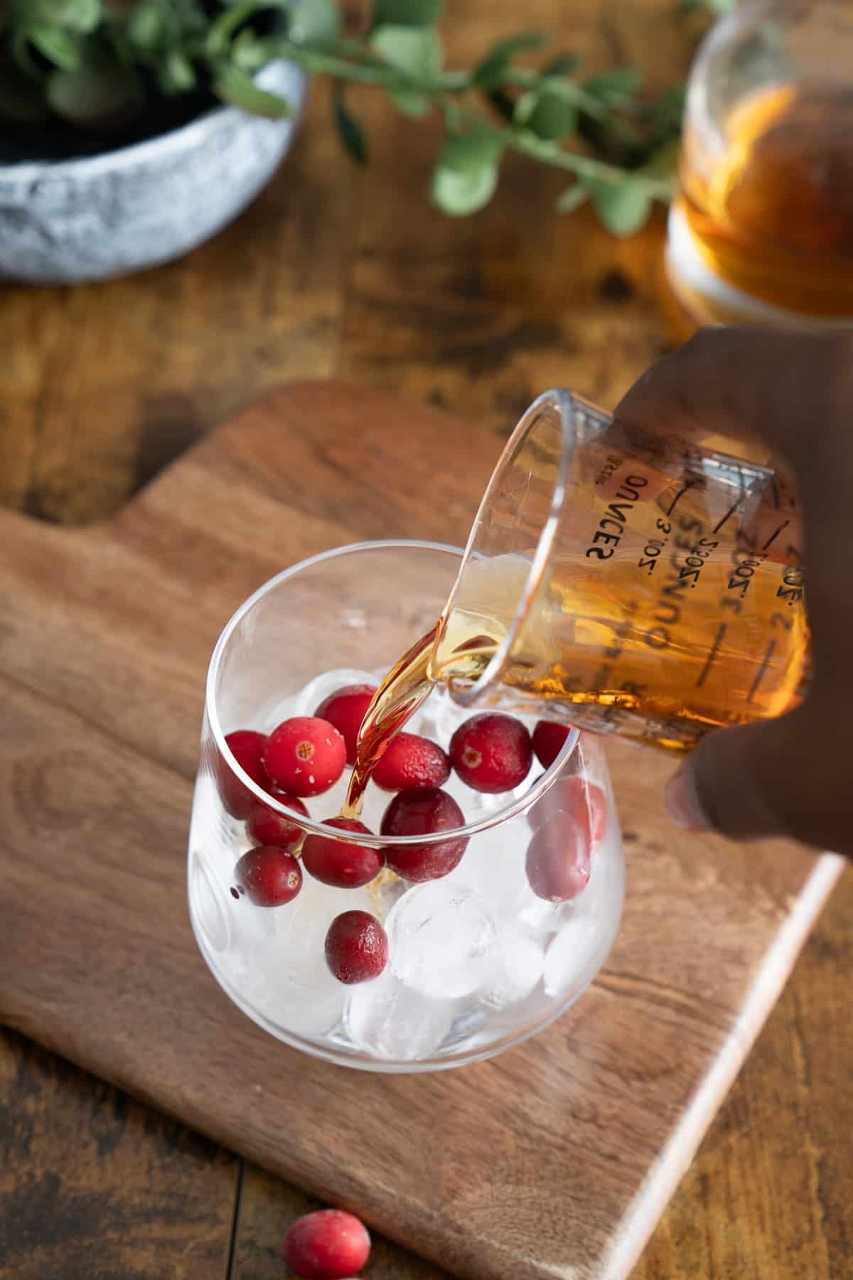 whiskey being poured into glass