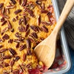 close up of dump cake with spoon taking some out