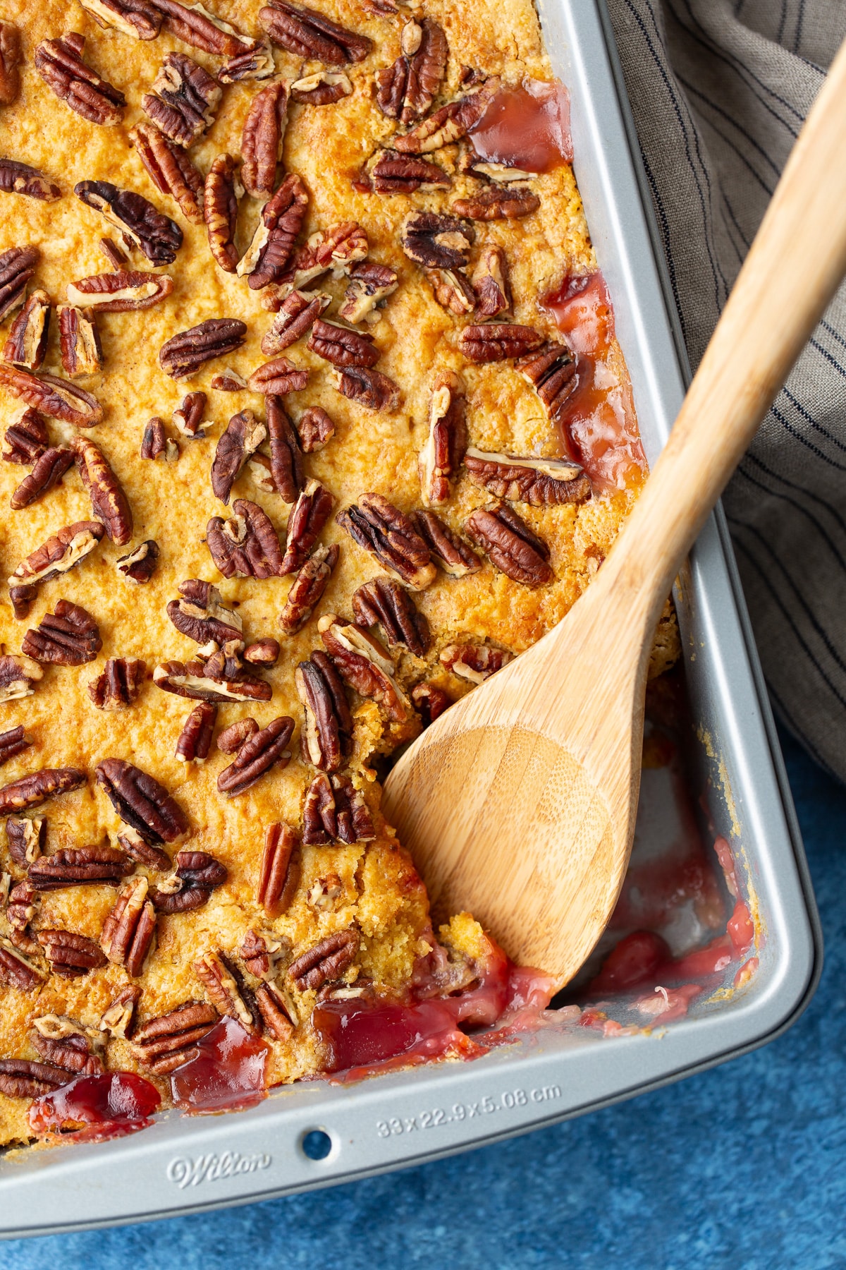 close up of dump cake with spoon taking some out