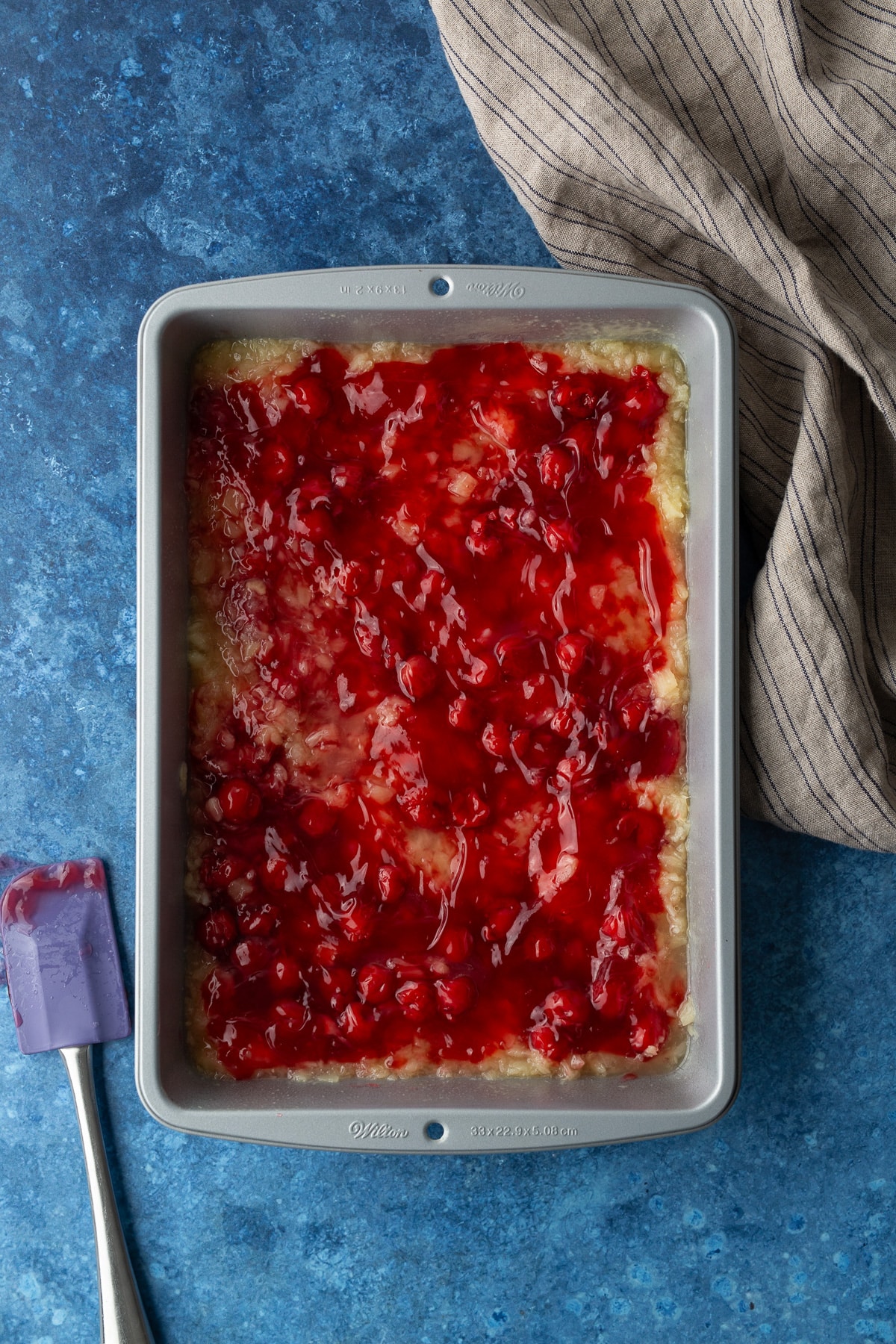 pineapple and cherry in baking pan