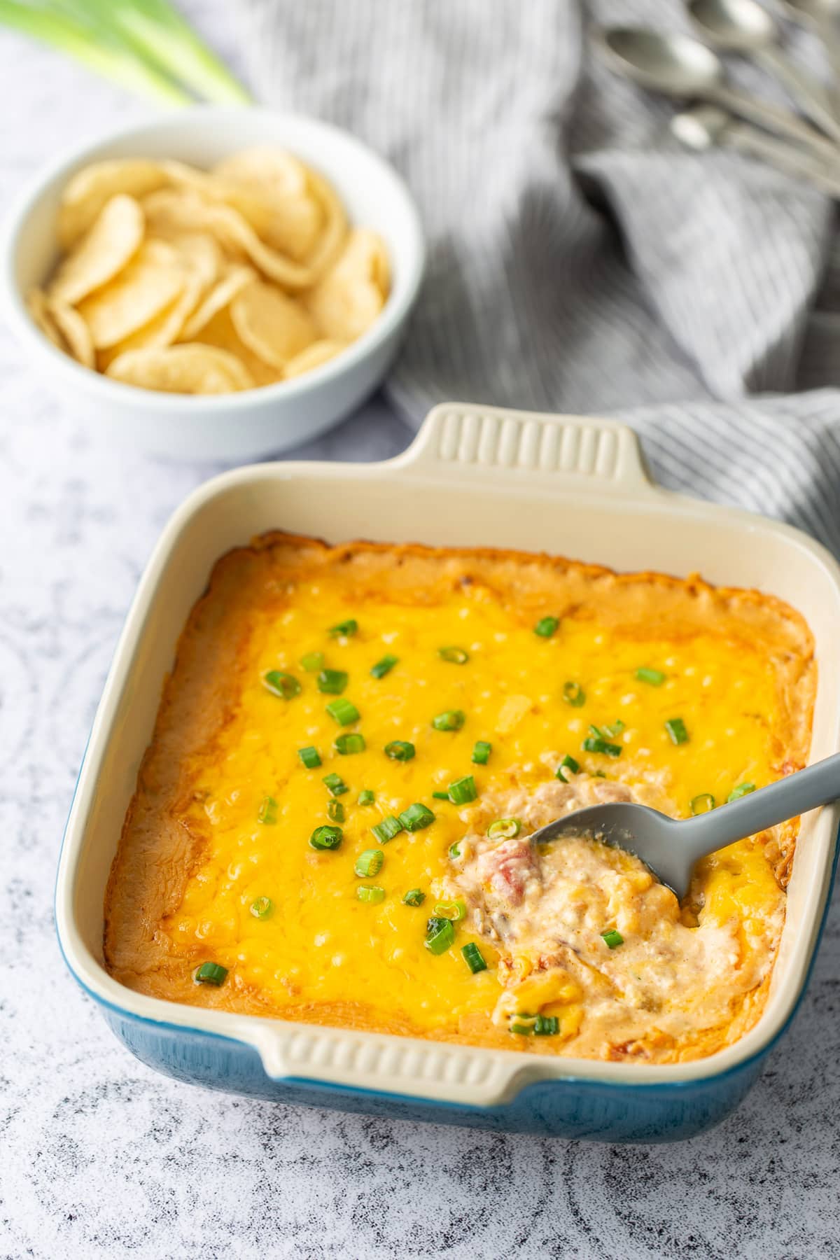 black eye pea dip with spoon lifting out dip