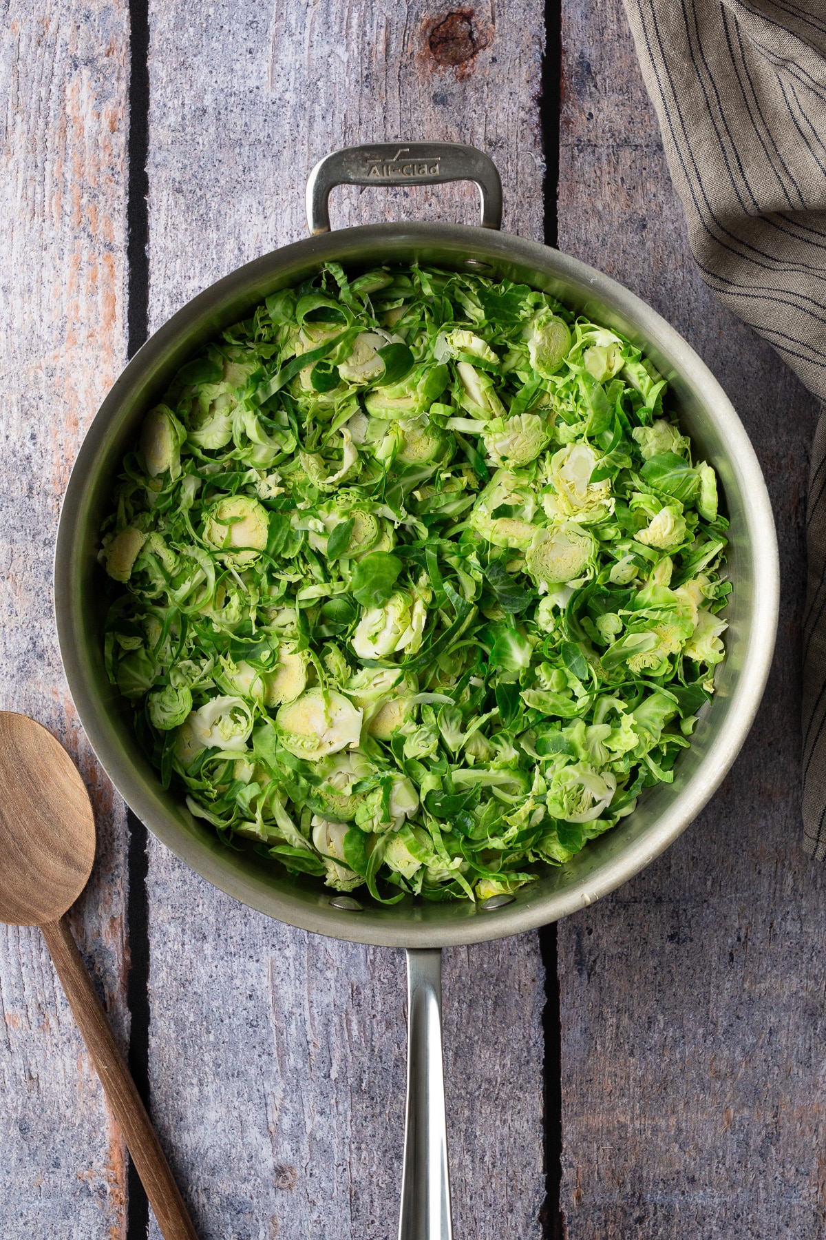 raw shredded brussels sprouts in pan