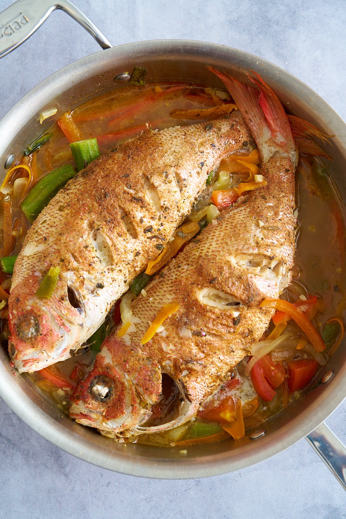 cooked steamed fish on top of vegetables