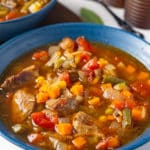 vegetable beef soup in blue bowl