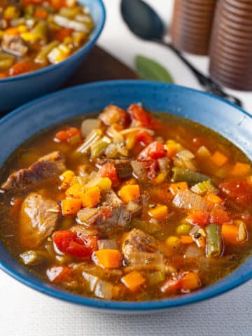 vegetable beef soup in blue bowl