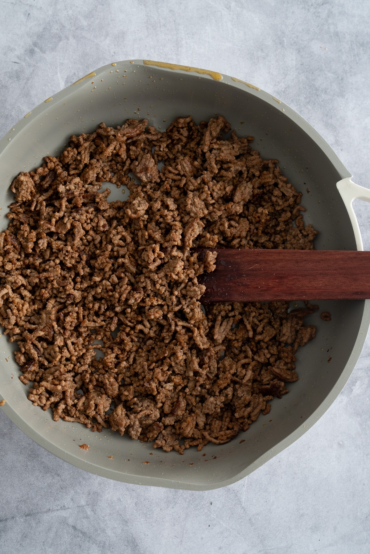 cooked ground beef in skillet