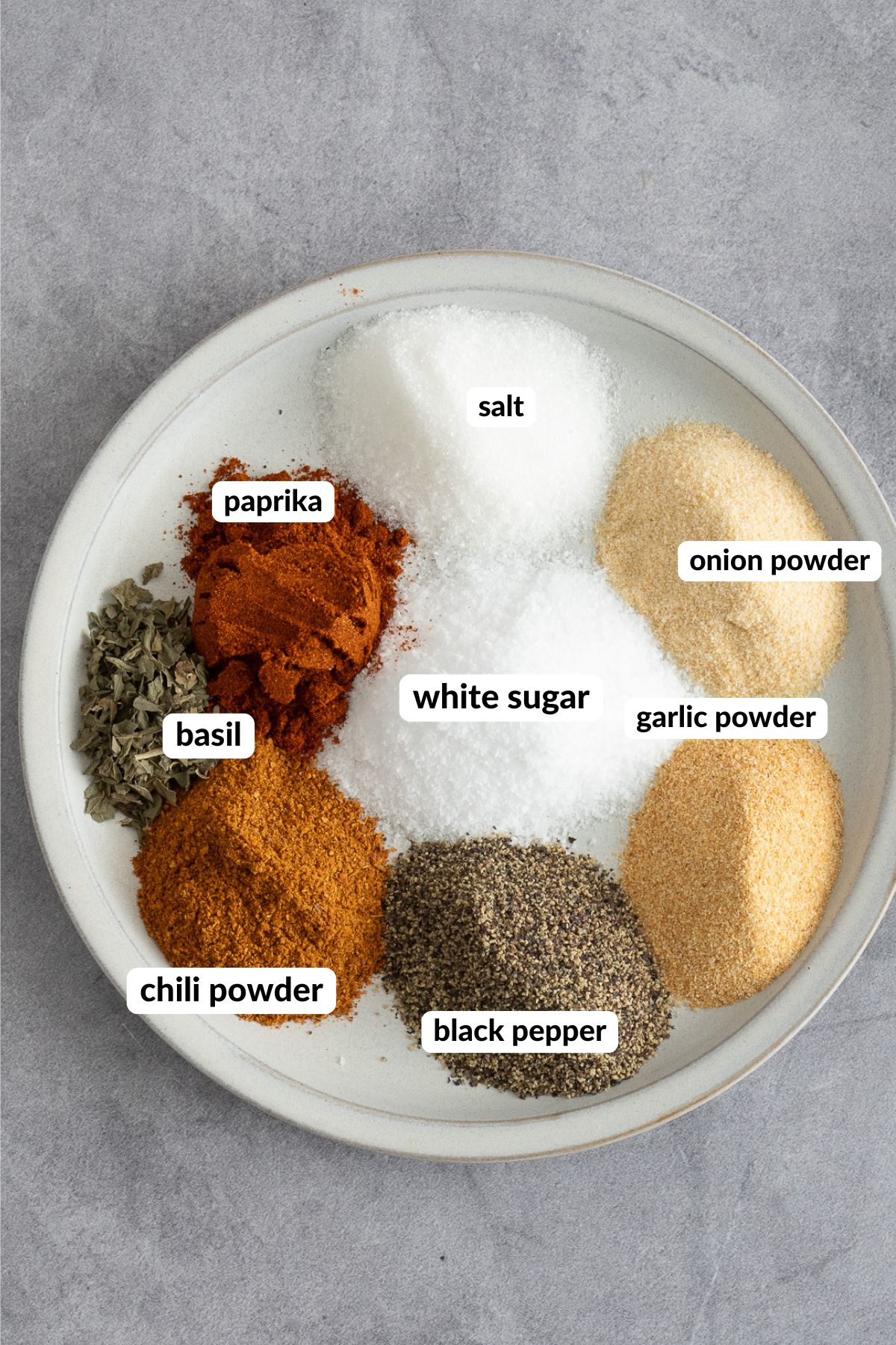 all the spices for french fry seasoning on a plate