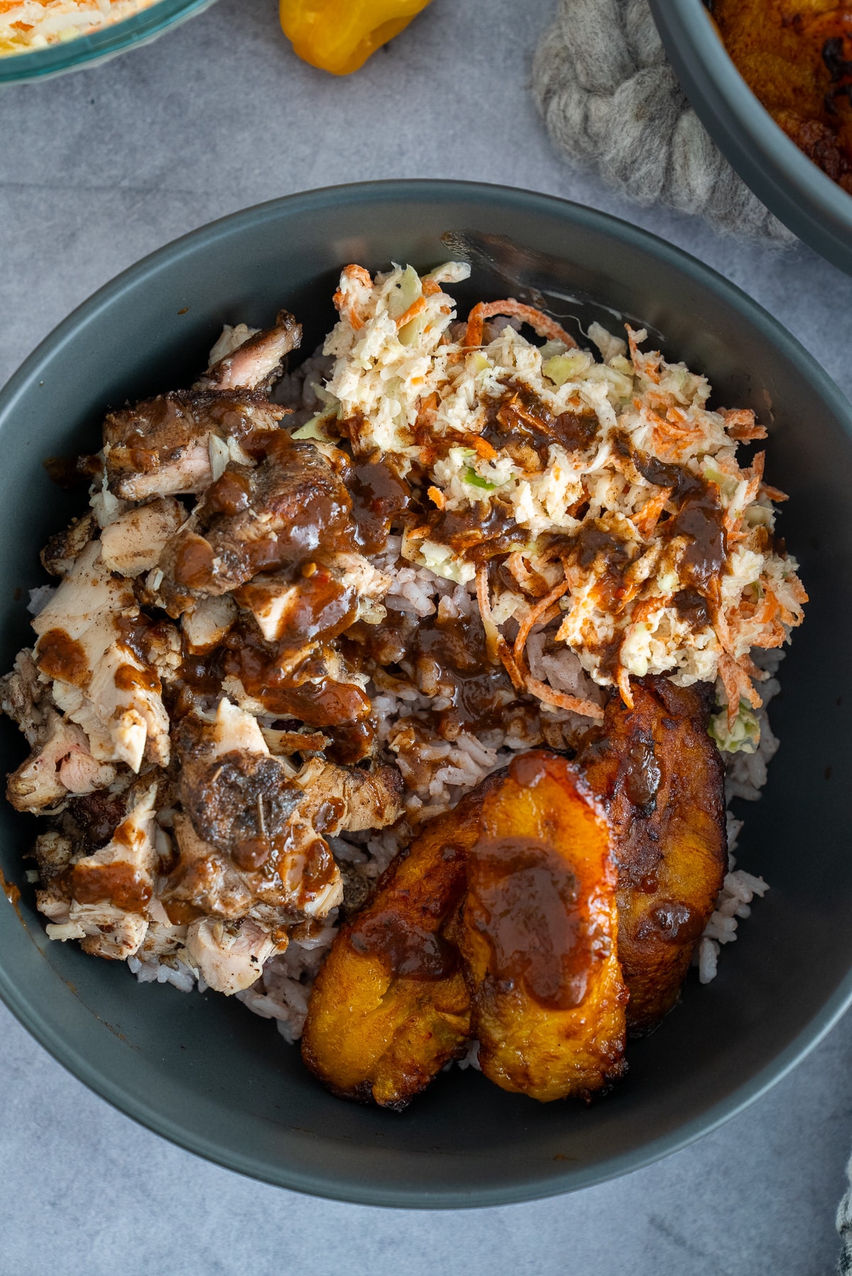 jerk chicken bowls. jerk chicken, rice, plantains, and jerk bbq sauce