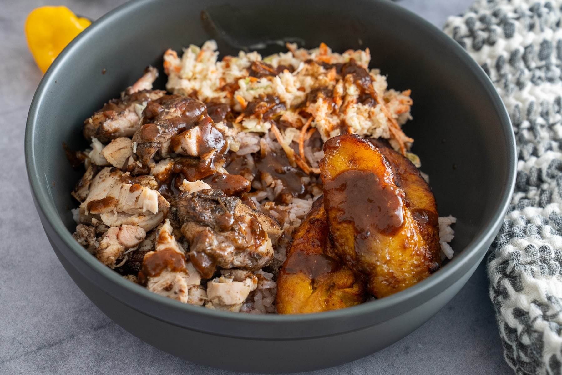 jerk chicken bowl on table