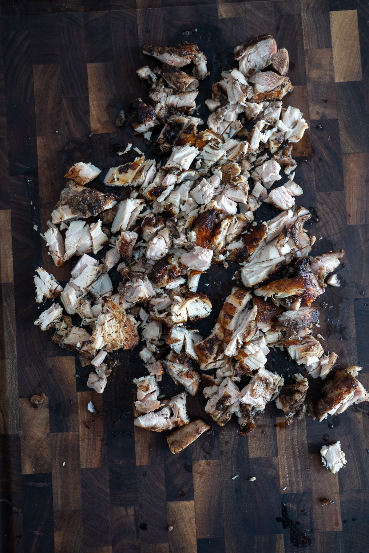 chopped jerk chicken on cutting board