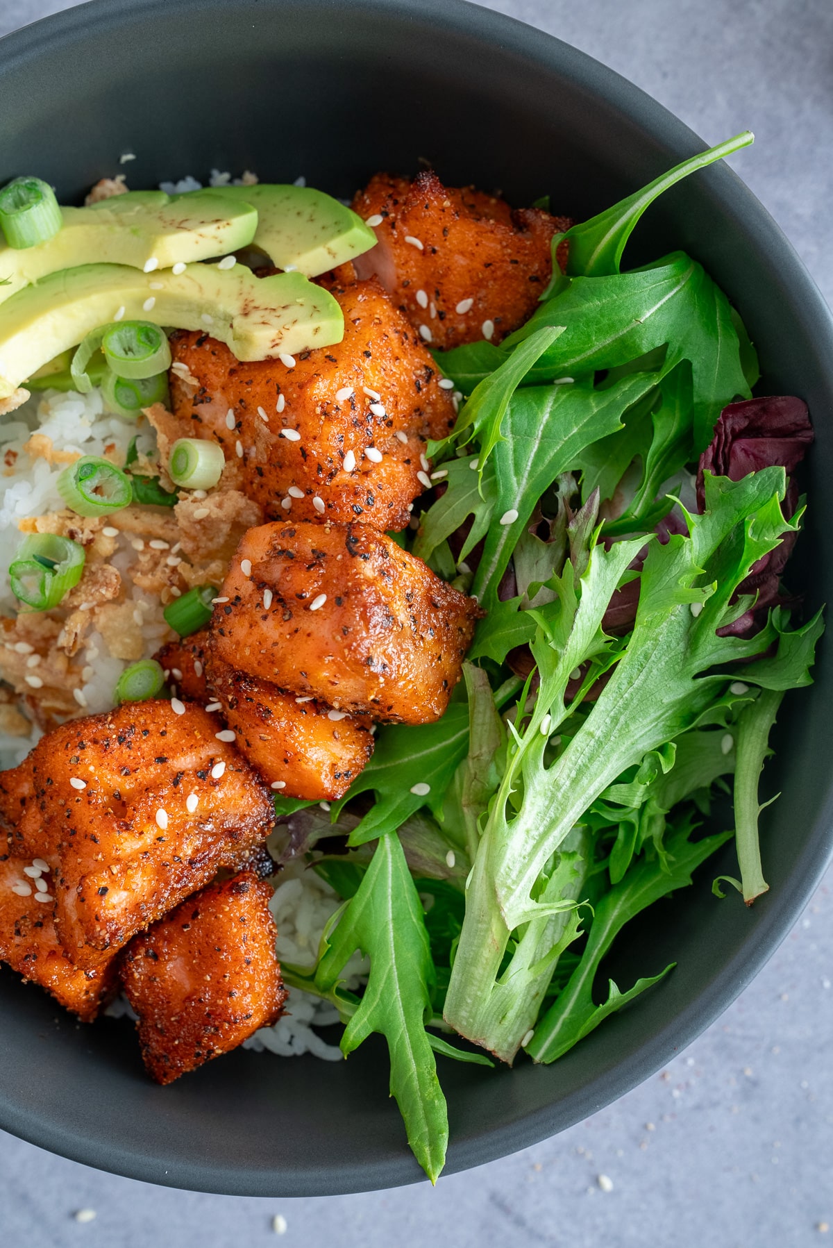 close up photo of salmon and greens in bowl