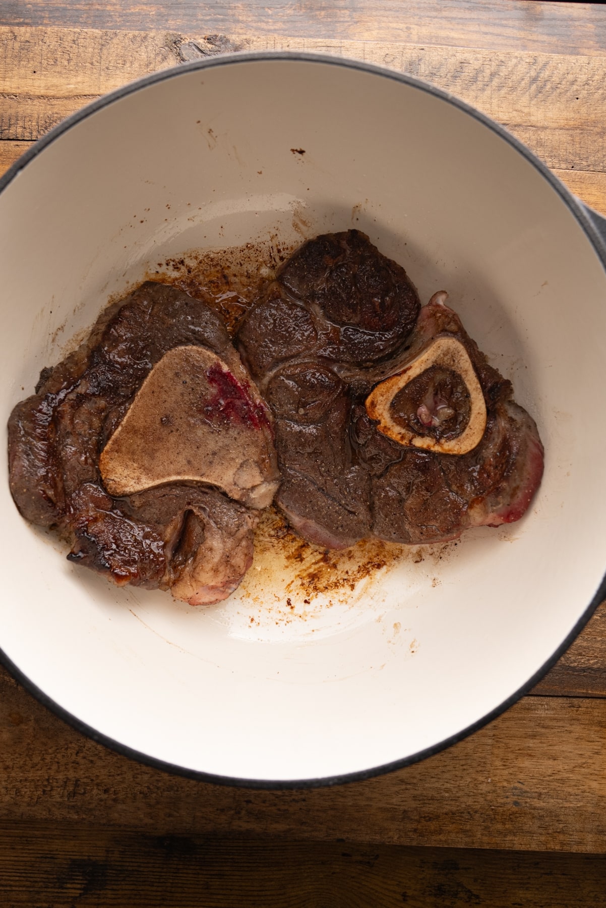 browned beef shanks in pot