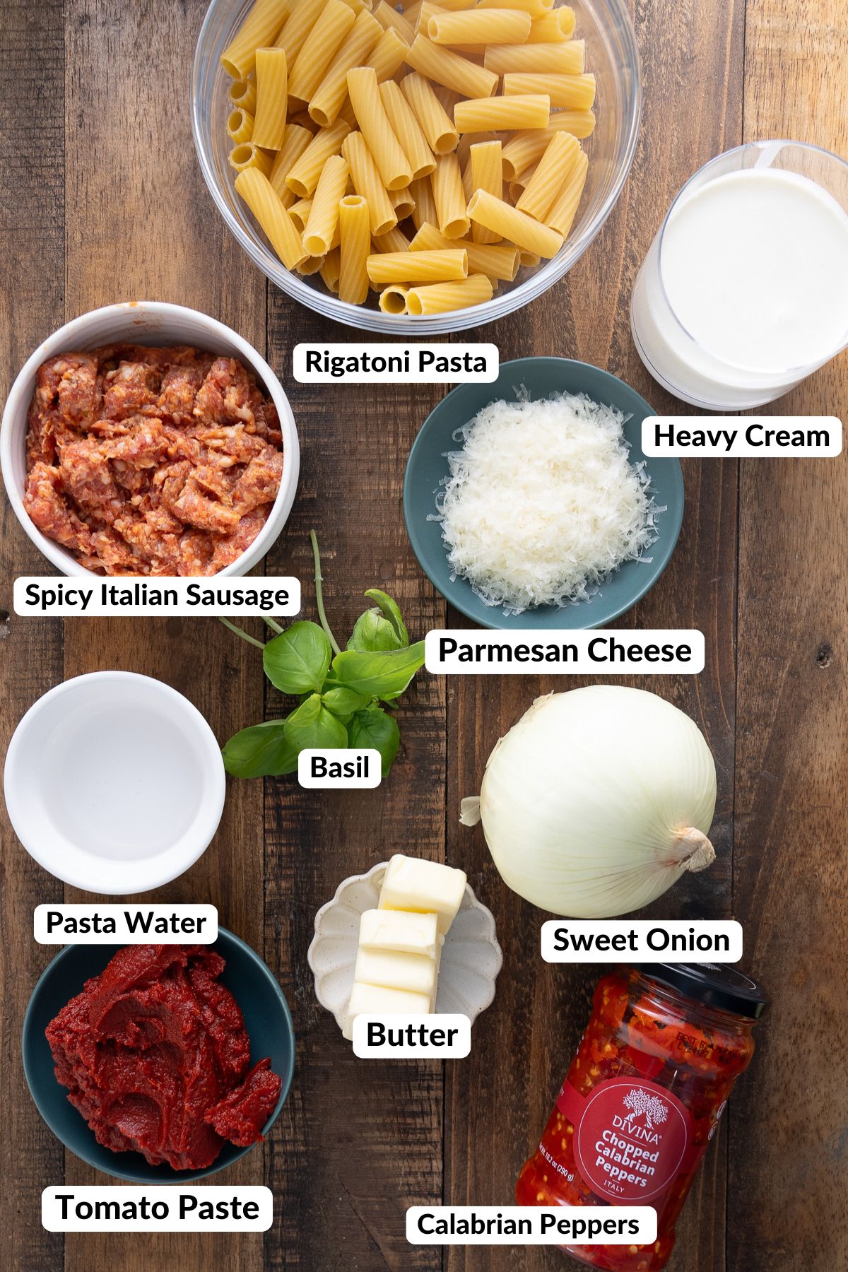 ingredients about spicy vodka rigatoni on table