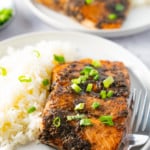 jerk salmon on a plate with white rice